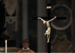 Image of Pope Benedict XVI venerates the Cross