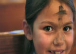 Image of Young boy praying on Ash Wednesday.